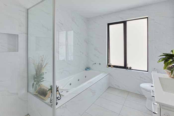 Marble Tiled Bathroom with Tiled Bath