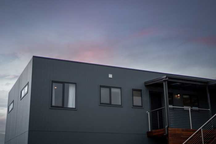 Contemporary Coastal Home with Grey Vertical Cladding