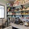 Compact Walk-in Pantry with Open Shelving
