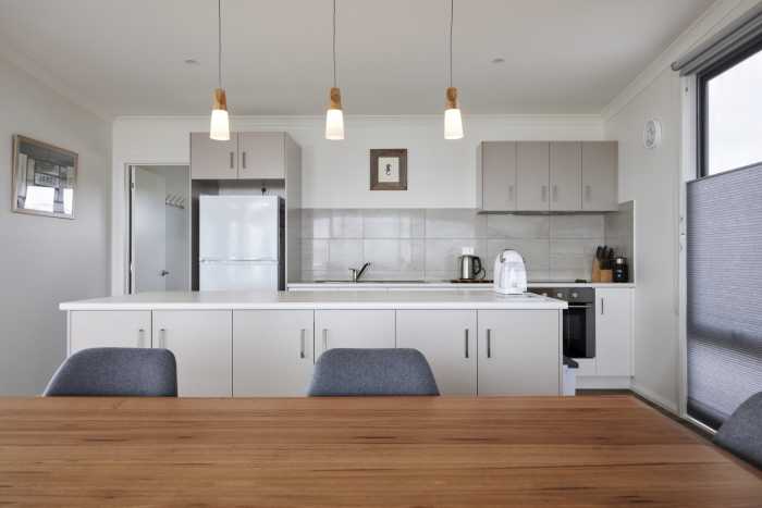 Simple Coastal Kitchen with Island Bench and Pendant Lights