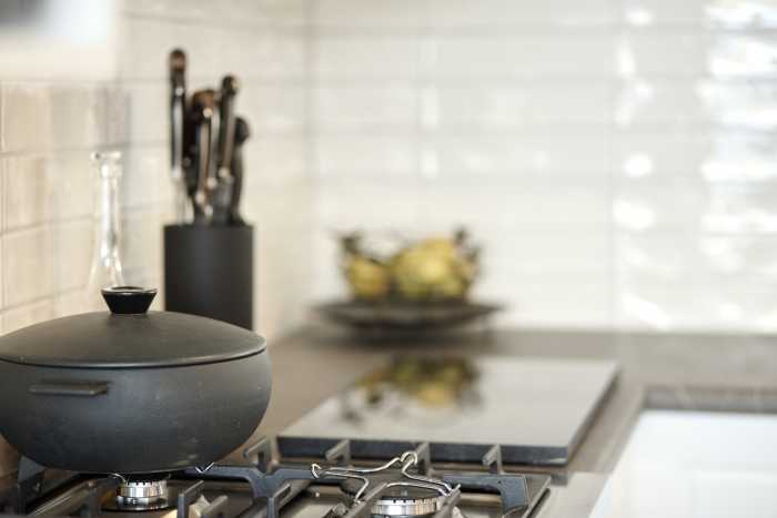 Modern Black Appliances in Black and White Kitchen